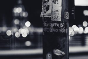 Pole with sticker reading "Big Data is Watching You". Photo by ev on Unsplash